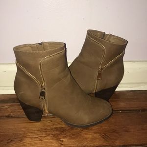 Very fashionable brown ankle high boots.